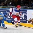 MINSK, BELARUS - MAY 14: Russia's Sergei Shirokov #52 skates with the puck while Kazakhstan's Roman Starchenko #48 defends during preliminary round action at the 2014 IIHF Ice Hockey World Championship. (Photo by Andre Ringuette/HHOF-IIHF Images)
